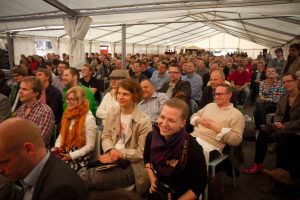 Crowd under a tent at an Aalto event