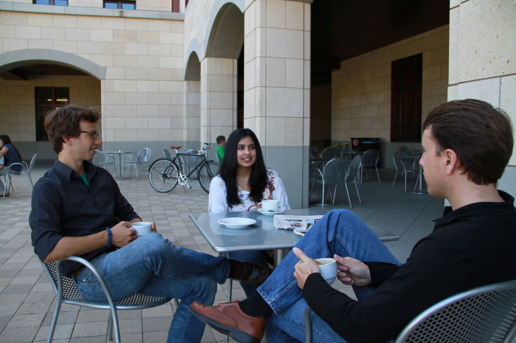 STVP PhD Students Doug Hannah, Sruthi Thatchenkery and Michael Leatherbee having coffee on the Stanford campus