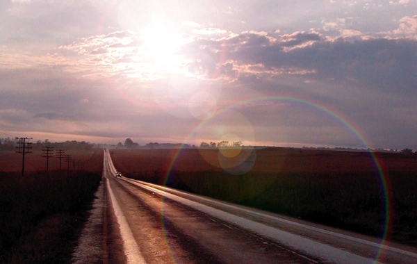 Long straight road at sunset