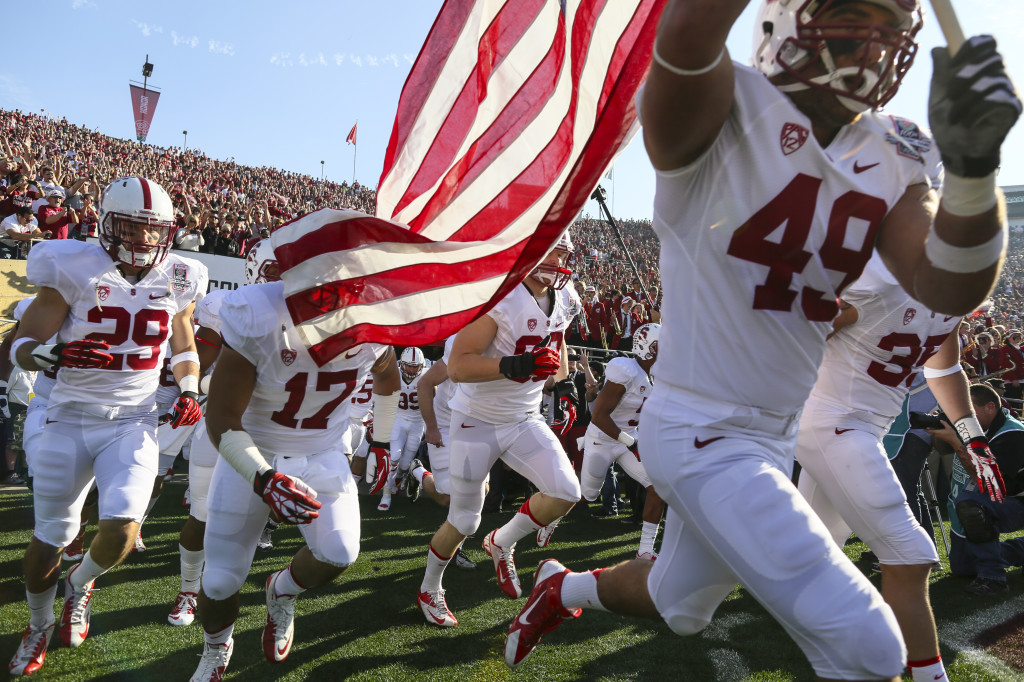 Photo - Stanford football team running onto field.