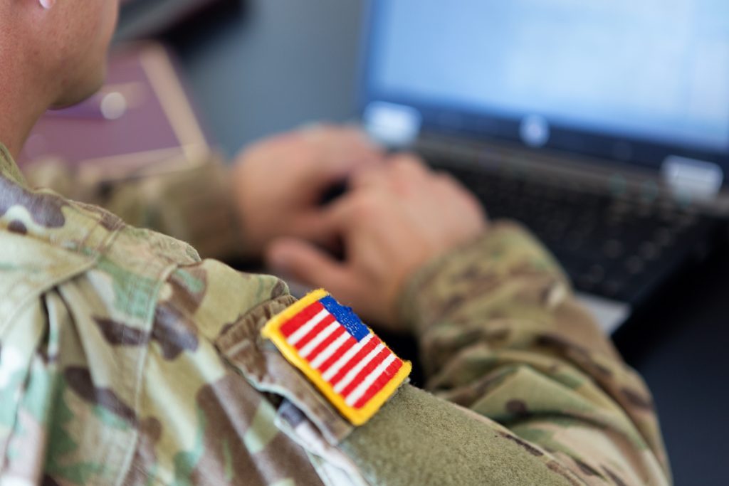 U.S. soldier working on laptop