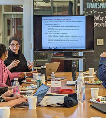 Researchers around a conference table